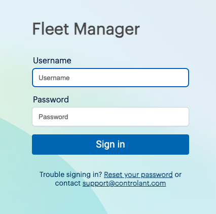 The login page of the Fleet Manager where the username and password field is still empty. Featuring a large blue sign-in button and a password reset link.